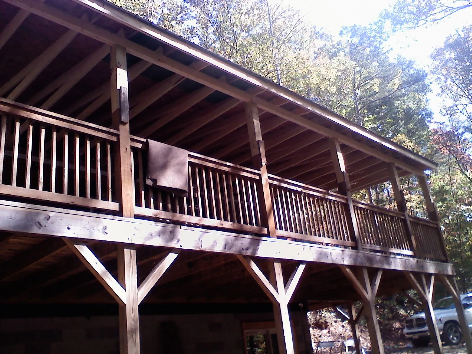 Timber framing under a new elevated porch and deck — Roof Leak Repair in East Baldwin by Roofing Brothers